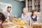 Smiling granny while sitting at dining table