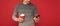 smiling grizzled guy hold phone on red background. hoary man drinking coffee.