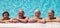 Smiling group of senior people in swimming pool enjoying the summer and retirement. Happiness under the bright sun. Blue