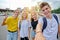 Smiling group of teenagers taking selfie, happy four teens looking at camera