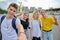 Smiling group of teenagers taking selfie, happy four teens looking at camera