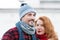 Smiling guy and rude hair woman. Portrait of lovely aged couple in city. Styled aged couple likes winter.