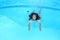 Smiling hairy Papuan woman swimming in pool