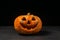 smiling Halloween pumpkin on a dark background