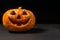 smiling Halloween pumpkin on a dark background