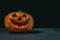 smiling Halloween pumpkin on a dark background