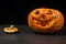 smiling Halloween pumpkin on a dark background