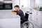 Smiling Handicapped Man Drinking Soup In The Kitchen