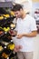 Smiling handsome buying a fruits