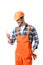 Smiling handyman in orange overall and helmet using smartphone