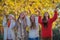 Smiling happy autumn teens leaves