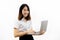 Smiling happy and cheerful Asian female formal dress holding a laptop notebook isolated over white background.