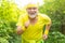Smiling happy elderly man running. Be in motion. Age is no excuse to slack on your health. Elderly man practicing sports