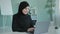 Smiling happy Islam businesswoman in black hijab freelancer Islamic Arabian girl student worker Muslim woman female