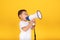 Smiling happy little asian children boy announcing using a megaphone loudspeaker discount sale