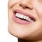 Smiling happy woman. Laughing female mouth with great teeth over white background. Healthy beautiful smile. Teeth health,