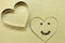 Smiling heart with chocolate eyes and smile with cooking shape heart top view. Romantic concept. Valentines day symbol.