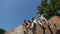 Smiling hikers taking selfie at mountain peak