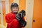 Smiling Hockey Player Posing in Locker Room