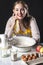 Smiling homemaker in kitchen