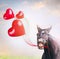 Smiling horse holding three red balloons in shape of hearts , holiday