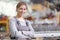 Smiling industrial female worker at workplace on manufacture workshop background