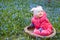 Smiling infant baby in flowers