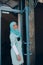 Smiling islamic girl in hijab open hotel door.