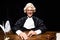 smiling judge in judicial robe and