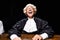 smiling judge in judicial robe and