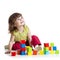 Smiling kid girl playing building cubes toys