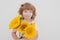 Smiling kid with sunflowers. Happy child with bouquet of flowers. Cute lovely boy romantic and surprise.