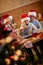 Smiling kids baking cookies with father on Christmas