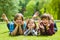 Smiling kids having fun at grass. Children playing outdoors in summer. teenagers communicate outdoor