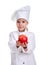 Smiling kind chef girl in a cap cook uniform, giving the red apple, stretching the arms. Human emotions, facial