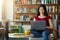 Smiling korean girl using laptop for online work or studies at cafe