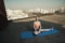 Smiling lady does stretching during workout