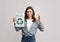 Smiling Lady Holding Motivational Placard With Recycle Sign And Showing Ok Gesture