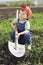 Smiling little boy with big shovel