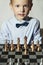 Smiling Little boy with chess.Smart kid.genius Child.Chessboard