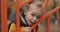 Smiling little boy at playground in park area, closeup portrait of happy face, happy childhood of light-haired child