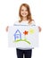 Smiling little child holding picture of house