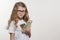 Smiling little girl with cash, white background, copy space.