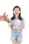 Smiling little girl holding a bouquet carnation