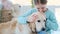 Smiling little girl hugging cute dog