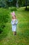 Smiling little girl with long blond hair wearing rabbit ears