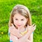 Smiling little girl with many-colored manicure