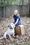 Smiling little girl outdoors with white dog