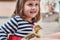 Smiling Little girl is playing with ducklings. Hands Holding Duckling