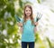 Smiling little girl with rake and scoop